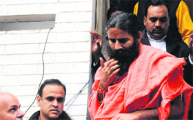 Yoga guru Baba Ramdev leaves the victims house in Khuda Lahora on Saturday.