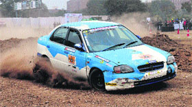 A car passes through a rough patch during the qualifying round of the the 5th edition of OYA Autocross, Motocross and Offroad Challenge at Phase VIII in Mohali on Saturday.