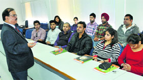 SD College principal Dr Bhushan K Sharma interacts with students at the college.