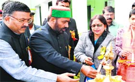 Education Minister Mantri Prasad Naithani lights a lamp during the inauguration of the two-day science fair at SSS Intermediate College in Haridwar on Saturday