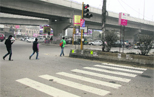 Several road dividers like this one at BMC Chowk in Jalandhar prevent pedestrians from using zebra crossings. 