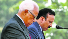 Governor NN Vohra administers the oath of office to Sajjad Kichloo during a swearing-in ceremony at Raj Bhawan on Saturday.
