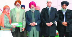 NRIs honour a student at Baba Gurmukh Singh Ut