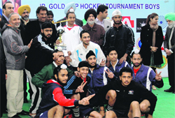 The Surjit Academy players celebrate their win in the final in Amritsar on Saturday. Tribune photo