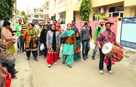 Members of the Unaided Staff Front hold a protest march by beating a drum in the ward of Chief Parliamentary Secretary Sarup Chand Singla in Bathinda on Sunday
