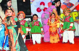 Festive mood: Tiny-tots of Bachpan, a playway school, present cultural items dressed in colourful attires, during functions held in Bathinda on Sunday