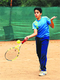 A player in action during the Shemrock Ace Tennis Tournament in Mohali on Sunday. 