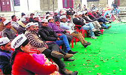 Workers of the Aam Aadmi Party take part in a convention at Ramsay College in Almora on Sunday