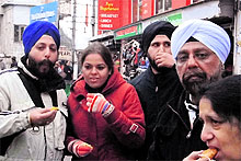 Families from Punjab enjoy food and hot tea with pakoras at a tea stall in biting cold in Mussoorie on Sunday
