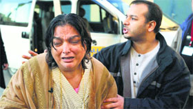 Grief-stricken: Fatima Khan, mother of deceased British doctor Shah Abbas Khan, who died in a Syrian prison, cries while her son Afroze Khan consoles her at a hospital in Beirut on Saturday.