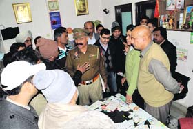 Relatives of the girl child being pacified by the SHO Kotwali at a private nursing home in Veer Colony on Monday