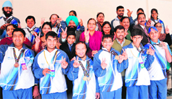 Special children with their parents and coach in a jubilant mood in Chandigarh. Tribune photo