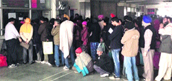 Patients and their attendants wait at the registration counter of New OPD at the PGI in Chandigarh on Monday. A Tribune photograph