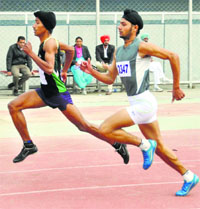 Athletes participate in the 200m race during the 59th Punjab State School Athletics meet in Ludhiana. 