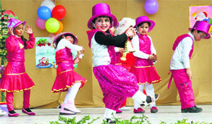 Tiny tots of Green Land Senior Secondary Public School present an item during the Christmas celebrations in Ludhiana. 