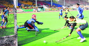 Players play a match during Shaheed Udham Singh girls junior hockey tournament at GNDU in Amritsar on Tuesday