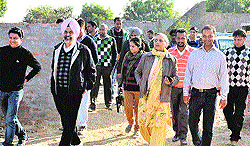Faculty members and students of the Central University of Punjab during a visit to the new main campus at Ghudda village (Bathinda) on Tuesday