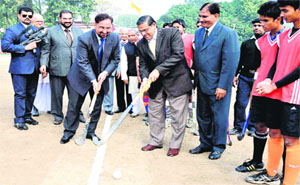 Uttarakhand DGP BS Siddhu plays a shot at the inaugural ceremony of the 82nd All- India Swami Shraddhanand Hockey Tournament at Gurukul Kangri University in Haridwar on Tuesday.