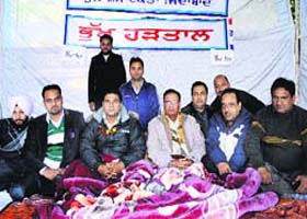 Staging protest: Members of the PUDA Joint Action Committee sit on hunger strike in Jalandhar on Tuesday