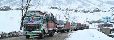 Trucks move towards Jammu from Srinagar after traffic was allowed to move on the national highway on Tuesday. 