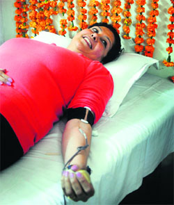 A volunteer donates blood during a camp organised by the Ivanna Institute of Fashion Technology and Hotel Management in Ludhiana.