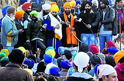 Sikh activists, demanding the release of Sikh detainees, gather outside Burail Jail in Chandigarh on Tuesday