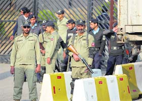 Pakistani paramilitary personnel stand guard outside a court in Islamabad on Tuesday