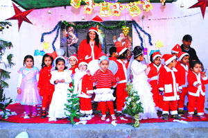 Christmas Carol: Small children at Daddys Teddy Playway School celebrate Christmas in Bathinda on Wednesday.
