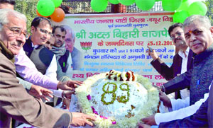 BJP workers celebrate the 89th birthday of former Prime Minister Atal Bihari Vajpayee in New Delhi on Wednesday.