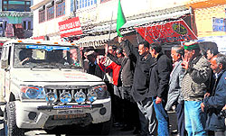MLA Ganesh Joshi flaggs off a car rally in Mussoorie on Wednesday