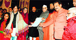 A green vision document for Uttarakhand being presented to Governor Aziz Qureshi at a workshop at Parmarth Niketan, Rishikesh, on Tuesday evening