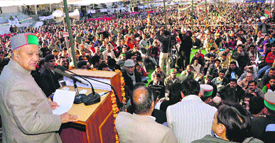 Chief Minister Virbhadra Singh addresses a mammoth gathering during a rally at Hamirpur on Wednesday. 