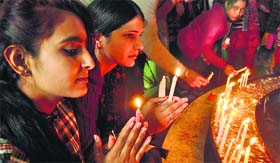 Devotees at St Marry's Garrison Church on Christmas in Jammu on Wednesday