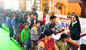 Devotees at St Marry's Garrison Church on Christmas in Jammu on Wednesday