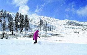A tourist in Gulmarg on Wednesday. The night temperature at the tourist resort dropped to -9.3C on Tuesday night