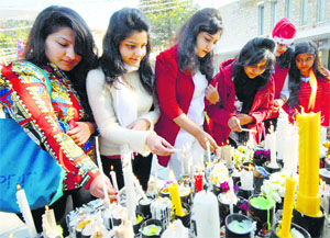 Girls light candles outside the St Xaviers church on Christmas in Jaipur on Wednesday