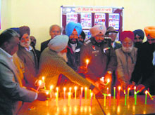People paying tributes to Malta boat tragedy victims in Hoshiarpur on Wednesday. Nearly 300 illegal immigrants, inluding many Punjabis, died when their boat capsised in Malta-Sicily channel in 1996. 