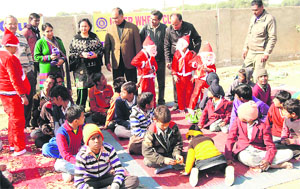 Rotarians celebrate Christmas with differently-abled children in Abohar on Wednesday.