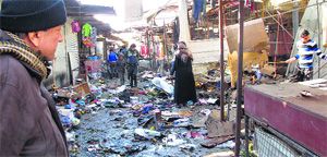 A man looks at the bomb attack site in Baghdad on Wednesday. 