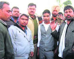 Members of the marriage procession showing their injury marks in Amritsar. 