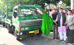 Mayor Subhash Chawla flags off the new dumper trucks in Sector 17, Chandigarh. Tribune photos: Parvesh Chauhan