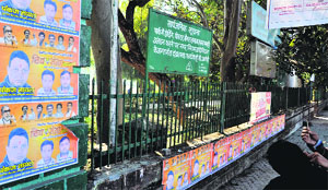 Despite a warning by the Dehradun Municipal Corporation against the putting up of posters, the walls of Gandhi Park are covered with the banners of a political party .