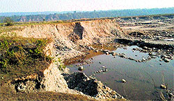 A view of the damaged agriculture land adjoining the Chakki river bed