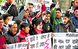 Activists of the SFI raise slogans against RUSA at the DC office in Shimla on Thursday