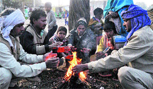 With a cold wave sweeping the region, these poor labourers huddle around a bonfire too keep themselves warm in Gurgaon on Thursday evening. 