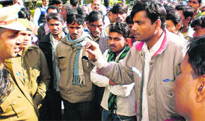 Irate slum dwellers protest the abduction of a six-year-old girl in Rewari on Thursday.