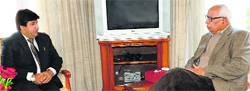 Governor NN Vohra interacts with MLC Dr Syed Bashir Ahmad Veeri at Raj Bhawan. A Tribune photograph