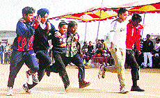 Students take part in a three-legged race during the annual sports day of Teja Singh Swatantar Memorial School in Ludhiana on Thursday