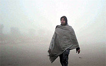 A resident on a morning walk amid dense fog in Ludhiana