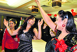 Members of the Sarabha Ladies Club celebrate Christmas and New Year; and (below) members of the Anti-Crime Association during a meeting in Ludhiana